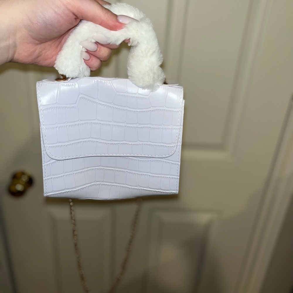 White purse with fuzzy handle